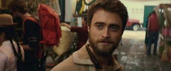 Movie still from “Jungle” (2017), directed by Greg McLean – A person with a beard; Close Up shot, Over the shoulder angle