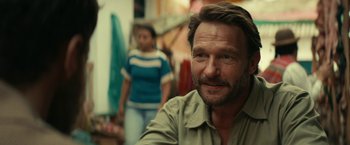 Movie still from “Jungle” (2017), directed by Greg McLean – A person with a person in the background; Close Up shot, Over the shoulder angle