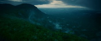 Movie still from “Jungle” (2017), directed by Greg McLean – A view of a valley from a helicopter; Extreme Wide shot, High angle