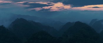 Movie still from “Jungle” (2017), directed by Greg McLean – A view of a mountain range at dusk; Extreme Wide shot, High angle