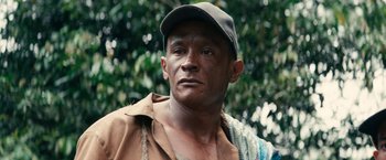 Movie still from “Jungle” (2017), directed by Greg McLean – A person wearing a hat; Close Up shot, Low angle