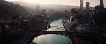 Movie still from “Jupiter Ascending” (2015), directed by Lilly Wachowski – A view of a river with a city in the background; Extreme Wide shot, Overhead angle