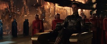 Movie still from “Jupiter Ascending” (2015), directed by Lilly Wachowski – A group of men in red and black outfits; Medium shot, Low angle