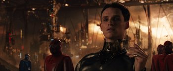 Movie still from “Jupiter Ascending” (2015), directed by Lilly Wachowski – A man in a leather jacket and a red mask; Close Up shot, Low angle