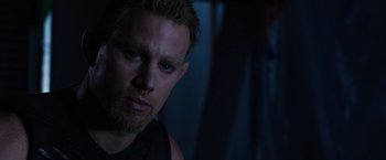 Movie still from “Jupiter Ascending” (2015), directed by Lilly Wachowski – A person wearing a black shirt; Close Up shot, High angle
