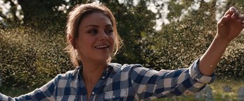 Movie still from “Jupiter Ascending” (2015), directed by Lilly Wachowski – A woman in a blue and white checkered shirt; Close Up shot, Over the shoulder angle