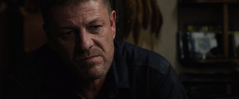 Movie still from “Jupiter Ascending” (2015), directed by Lilly Wachowski – A person wearing a black shirt; Close Up shot, Over the shoulder angle