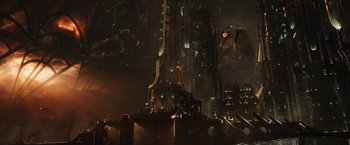Movie still from “Jupiter Ascending” (2015), directed by Lilly Wachowski – An image of a city with a dark sky in the background; Extreme Wide shot, High angle