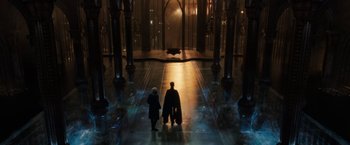 Movie still from “Jupiter Ascending” (2015), directed by Lilly Wachowski – Two people are standing in a large room; Extreme Wide shot, High angle