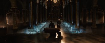 Movie still from “Jupiter Ascending” (2015), directed by Lilly Wachowski – Two people are standing in a dark room; Extreme Wide shot, High angle