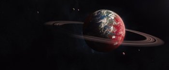 Movie still from “Jupiter Ascending” (2015), directed by Lilly Wachowski – An image of an earth and a ring in space; Extreme Wide shot, High angle