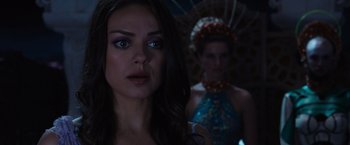 Movie still from “Jupiter Ascending” (2015), directed by Lilly Wachowski – A woman standing next to a man in a blue dress; Close Up shot, Over the shoulder angle