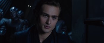 Movie still from “Jupiter Ascending” (2015), directed by Lilly Wachowski – A person wearing a black shirt; Close Up shot, Over the shoulder angle