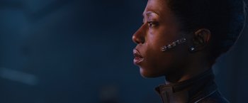 Movie still from “Jupiter Ascending” (2015), directed by Lilly Wachowski – A person wearing a headset; Close Up shot, Low angle