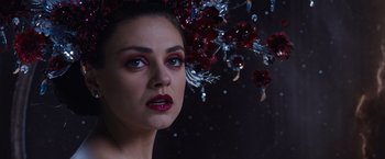 Movie still from “Jupiter Ascending” (2015), directed by Lilly Wachowski – A beautiful woman with red lipstick on her lips; Close Up shot, Over the shoulder angle