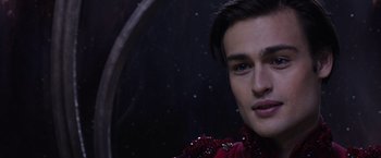 Movie still from “Jupiter Ascending” (2015), directed by Lilly Wachowski – A person wearing a red shirt; Close Up shot, Over the shoulder angle