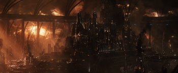 Movie still from “Jupiter Ascending” (2015), directed by Lilly Wachowski – An image of a city that is burning in the dark; Extreme Wide shot, High angle