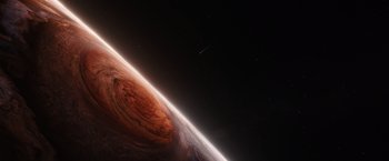 Movie still from “Jupiter Ascending” (2015), directed by Lilly Wachowski – An image of an earth from space with a star in the background; Extreme Wide shot, Overhead angle