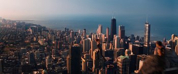 Movie still from “Jupiter Ascending” (2015), directed by Lilly Wachowski – An aerial view of a large city at sunset; Extreme Wide shot, High angle