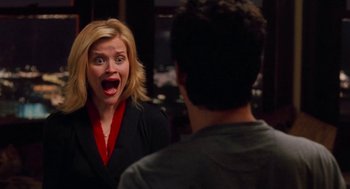 Movie still from “Just Like Heaven” (2005), directed by Mark Waters – A woman with her mouth wide open looking at a man in a suit; Medium shot, Over the shoulder angle