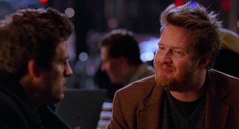 Movie still from “Just Like Heaven” (2005), directed by Mark Waters – Two men sitting at a table talking to each other; Close Up shot, Over the shoulder angle