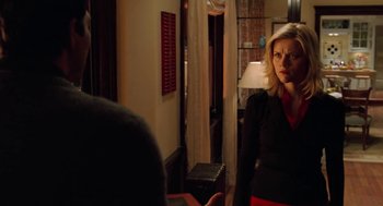 Movie still from “Just Like Heaven” (2005), directed by Mark Waters – A woman standing in front of a man in front of a lamp; Medium shot, Over the shoulder angle