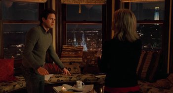 Movie still from “Just Like Heaven” (2005), directed by Mark Waters – A man and a woman in front of a large window; Medium shot, Over the shoulder angle