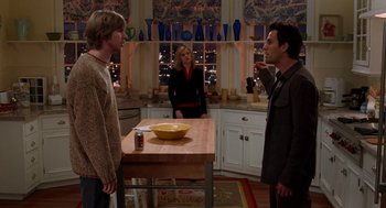 Movie still from “Just Like Heaven” (2005), directed by Mark Waters – Two men and a woman standing in a kitchen; Medium shot, Over the shoulder angle