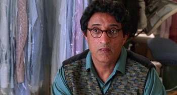 Movie still from “Just Like Heaven” (2005), directed by Mark Waters – A person wearing glasses and a vest; Close Up shot, Over the shoulder angle