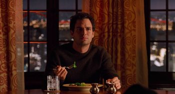 Movie still from “Just Like Heaven” (2005), directed by Mark Waters – A man sitting at a table with a plate of food; Medium shot, Over the shoulder angle