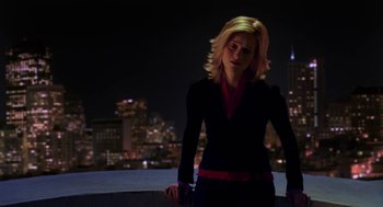 Movie still from “Just Like Heaven” (2005), directed by Mark Waters – A woman standing on top of a building at night; Medium shot, Low angle