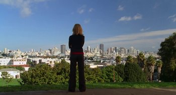 Movie still from “Just Like Heaven” (2005), directed by Mark Waters – A woman looking out over a city from a hill; Wide shot, Low angle
