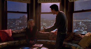 Movie still from “Just Like Heaven” (2005), directed by Mark Waters – A man and a woman in front of a large window; Medium shot, Over the shoulder angle