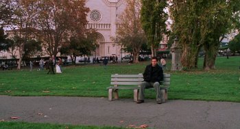Movie still from “Just Like Heaven” (2005), directed by Mark Waters – A man sitting on top of a wooden park bench; Extreme Wide shot, High angle