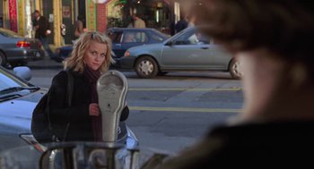Movie still from “Just Like Heaven” (2005), directed by Mark Waters – A woman standing in front of a parking meter; Medium shot, Over the shoulder angle