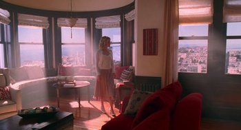 Movie still from “Just Like Heaven” (2005), directed by Mark Waters – A woman standing in front of a window in a living room; Wide shot, Low angle