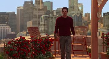 Movie still from “Just Like Heaven” (2005), directed by Mark Waters – A man standing in front of some chairs and flowers; Wide shot, Low angle
