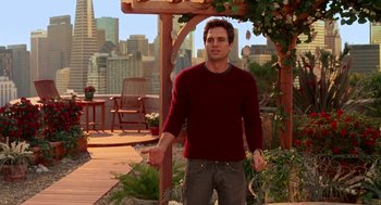 Movie still from “Just Like Heaven” (2005), directed by Mark Waters – A man in a red sweater standing on a deck; Medium shot, Over the shoulder angle