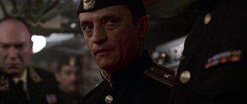 Movie still from “K-19: The Widowmaker” (2002), directed by Kathryn Bigelow – A person wearing a uniform; Close Up shot, Low angle