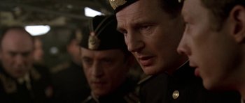 Movie still from “K-19: The Widowmaker” (2002), directed by Kathryn Bigelow – Two men in military uniforms looking at the camera; Close Up shot, Low angle