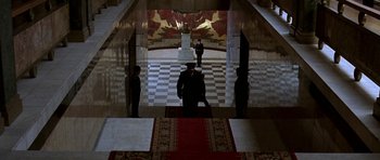 Movie still from “K-19: The Widowmaker” (2002), directed by Kathryn Bigelow – A group of men standing inside of a building; Extreme Wide shot, High angle