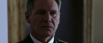 Movie still from “K-19: The Widowmaker” (2002), directed by Kathryn Bigelow – A person wearing a military uniform; Close Up shot, Low angle