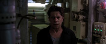 Movie still from “K-19: The Widowmaker” (2002), directed by Kathryn Bigelow – A person wearing a black shirt; Close Up shot, Low angle