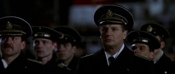 Movie still from “K-19: The Widowmaker” (2002), directed by Kathryn Bigelow – Two men in military uniforms are standing together; Medium shot, Low angle