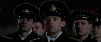 Movie still from “K-19: The Widowmaker” (2002), directed by Kathryn Bigelow – A group of men in uniform standing next to each other; Close Up shot, Low angle