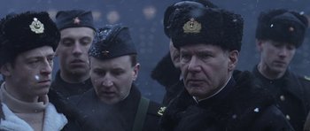 Movie still from “K-19: The Widowmaker” (2002), directed by Kathryn Bigelow – A group of men wearing military uniforms and hats; Close Up shot, Low angle