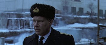 Movie still from “K-19: The Widowmaker” (2002), directed by Kathryn Bigelow – A person wearing a hat; Close Up shot, Low angle