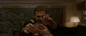 Movie still from “K-19: The Widowmaker” (2002), directed by Kathryn Bigelow – A group of people holding glasses of alcohol; Close Up shot, Low angle