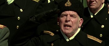 Movie still from “K-19: The Widowmaker” (2002), directed by Kathryn Bigelow – An old man in a military uniform is crying; Close Up shot, Low angle