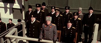 Movie still from “K-19: The Widowmaker” (2002), directed by Kathryn Bigelow – A group of men in military uniforms posing for a picture; Medium shot, Low angle